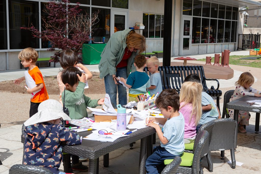 Children work on learning projects in the outdoor classroom at the Child Development Lab.